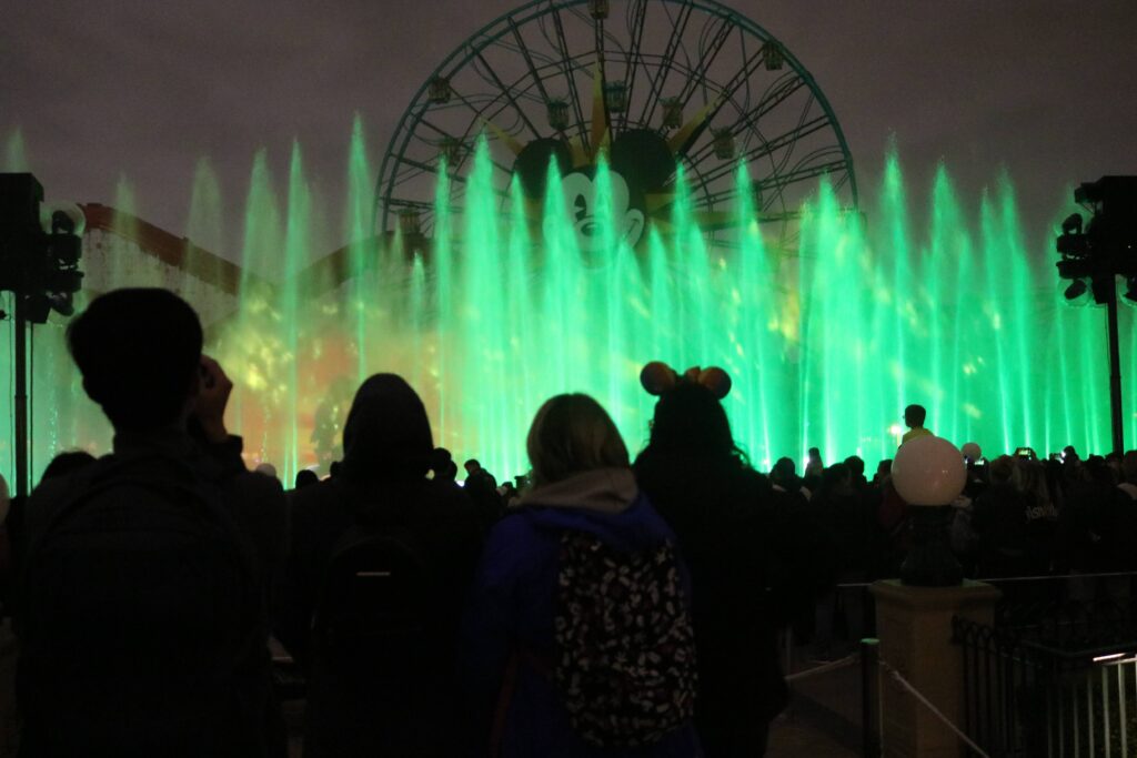 Silhouette crowd watching fountains