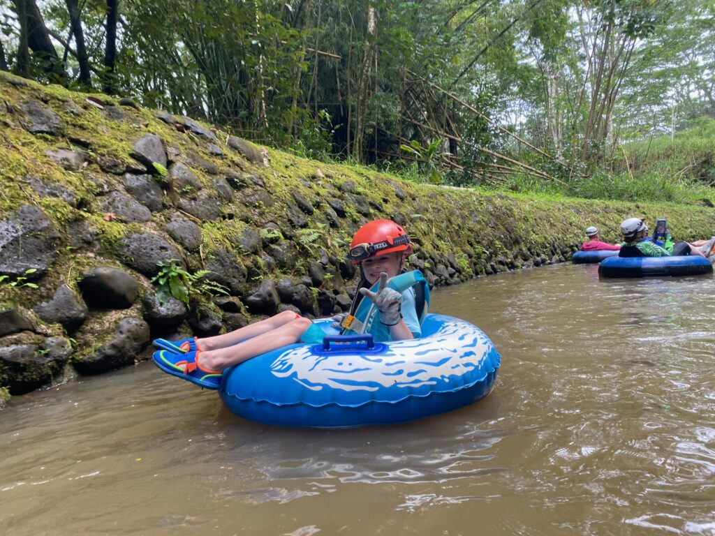 Lisa & Rob McKenzie with son Ian in Princeville on Kauai island Hawaii child tubing down old sugar cane canals